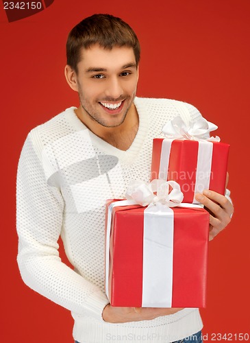 Image of man holding many gift boxes