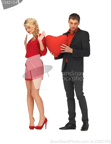 Image of beautiful couple holding big heart