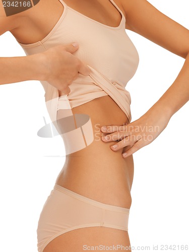 Image of woman body in beige cotton undrewear