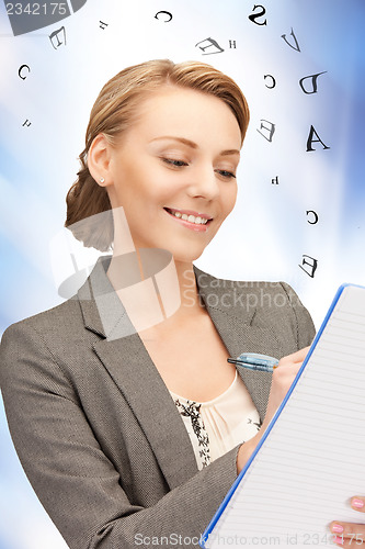 Image of happy woman with big notepad