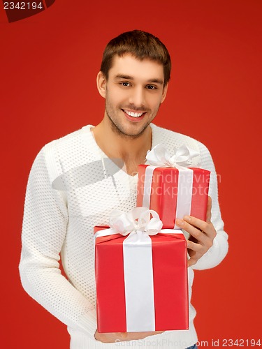 Image of man holding many gift boxes