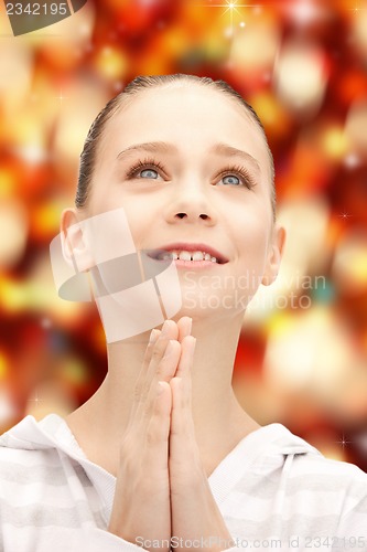 Image of praying teenage girl