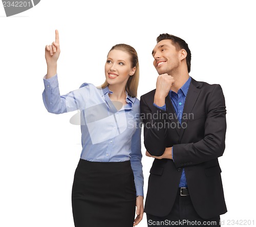 Image of man and woman pointing their fingers