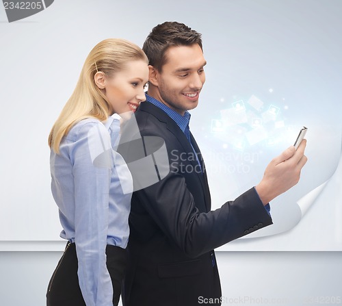 Image of man and woman with smartphone