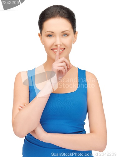 Image of woman making a hush gesture