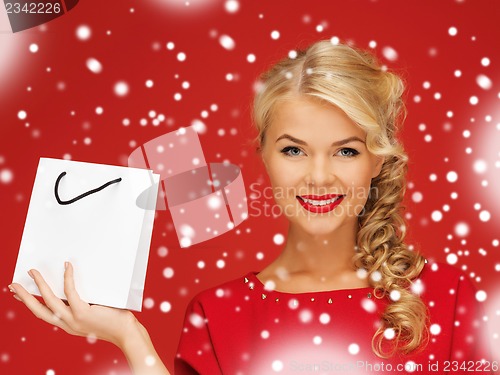 Image of lovely woman in red dress with shopping bag