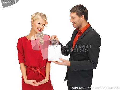 Image of man and woman with present