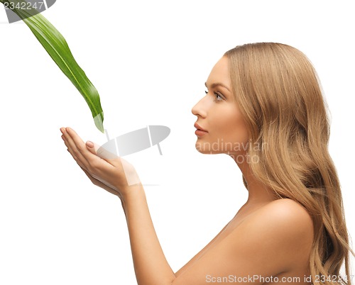 Image of woman with green leaf