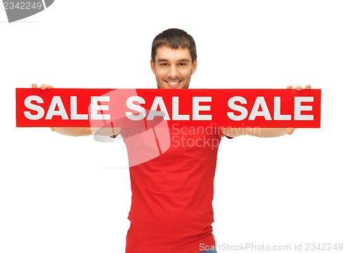 Image of handsome man with sale sign