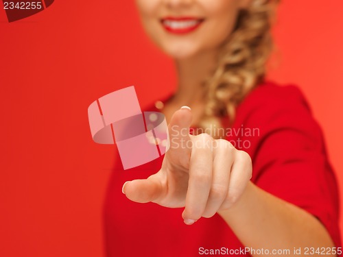 Image of woman in red dress pressing virtual button