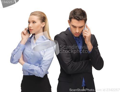 Image of man and woman with cell phones