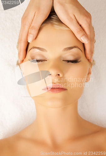 Image of beautiful woman in massage salon