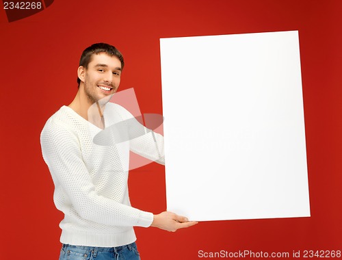 Image of handsome man with big blank board
