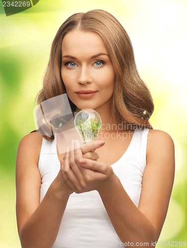 Image of woman with energy saving bulb