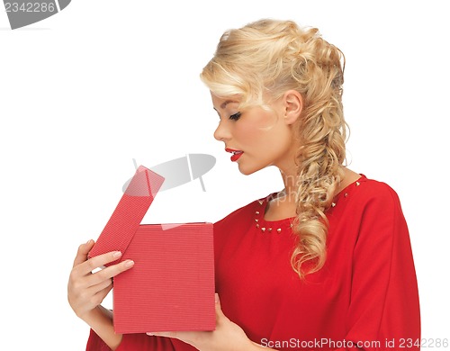 Image of lovely woman in red dress with opened gift box