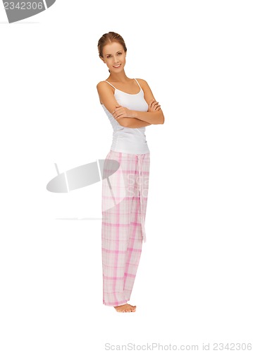 Image of happy and smiling woman in cotton pajamas