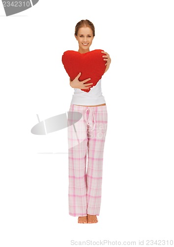 Image of woman in cotton pajamas with big heart