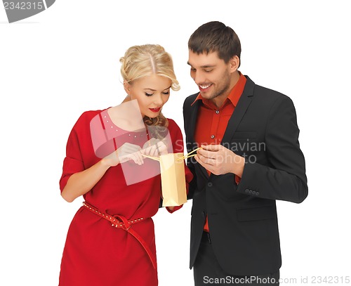 Image of man and woman with present