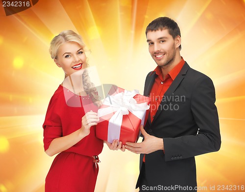 Image of man and woman with present