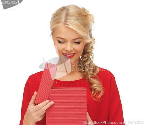 Image of lovely woman in red dress with opened gift box