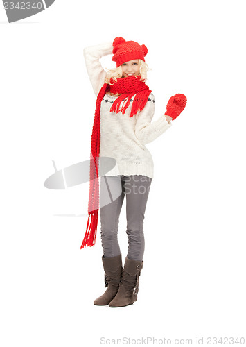 Image of beautiful woman in hat, muffler and mittens