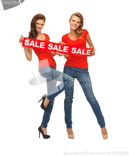 Image of two teenage girls with sale sign