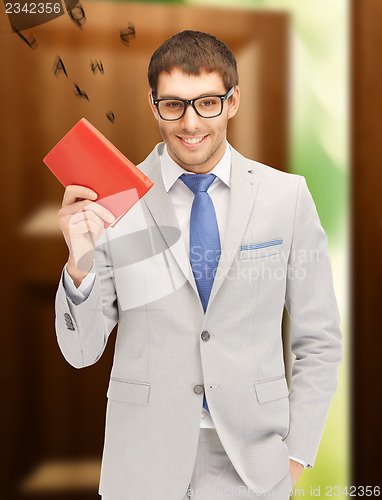 Image of happy man with book