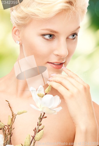 Image of lovely woman with twig