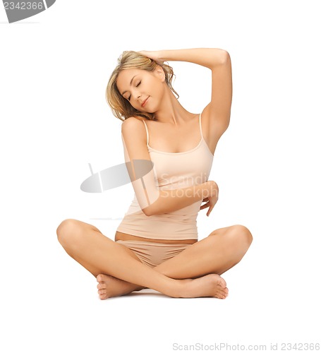 Image of woman practicing yoga lotus pose