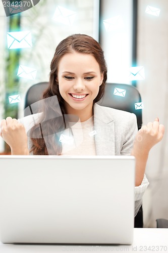 Image of happy woman with laptop computer