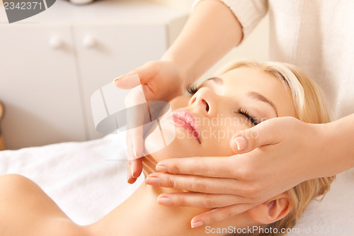 Image of beautiful woman in massage salon