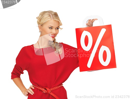 Image of beautiful woman in red dress with shopping bag