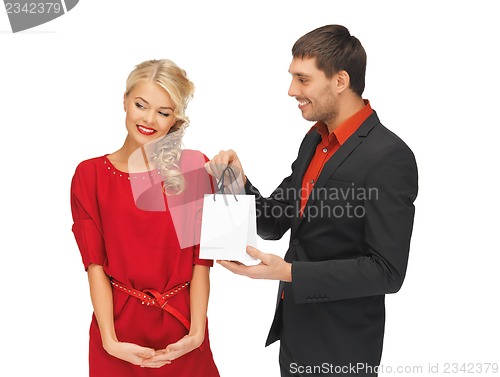 Image of man and woman with present