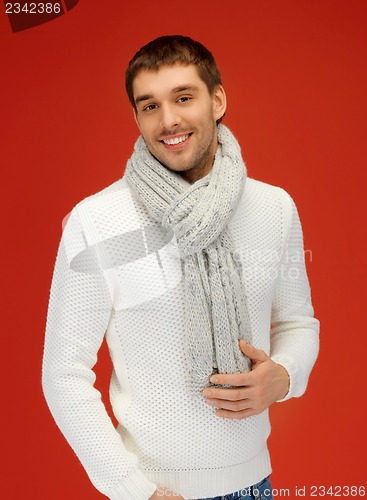 Image of handsome man in warm sweater and scarf