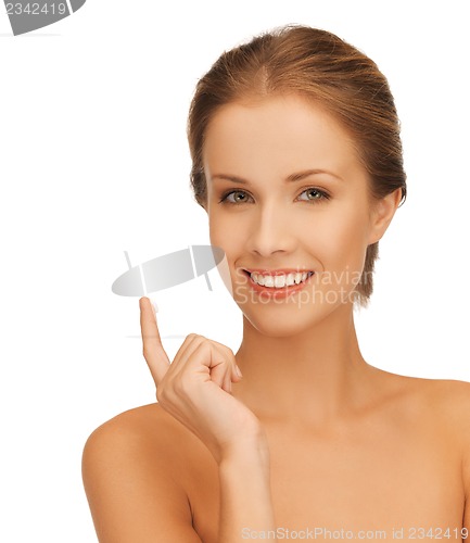 Image of beautiful woman with moisturizing creme drop