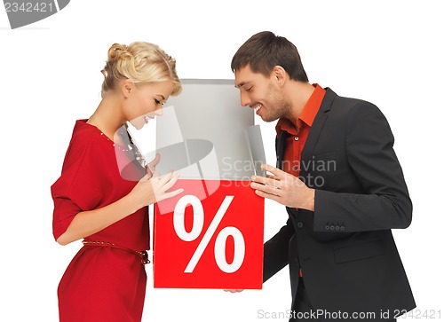 Image of man and woman with percent sign