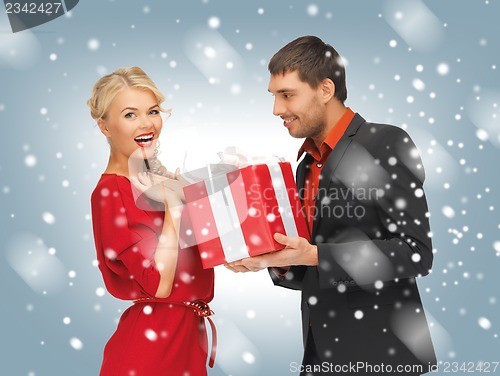 Image of man and woman with present