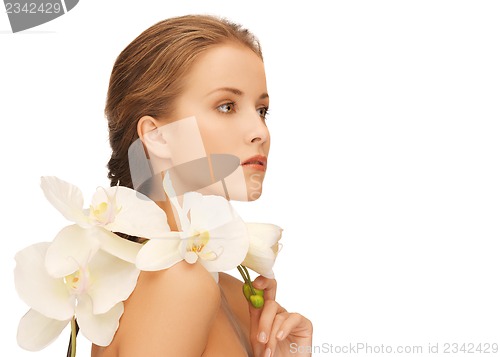 Image of lovely woman with orchid flower