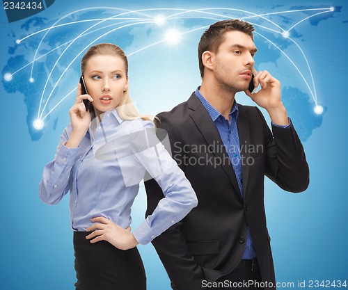 Image of man and woman with cell phones