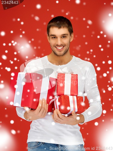 Image of man holding many gift boxes