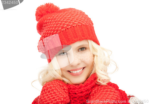 Image of beautiful woman in hat, muffler and mittens