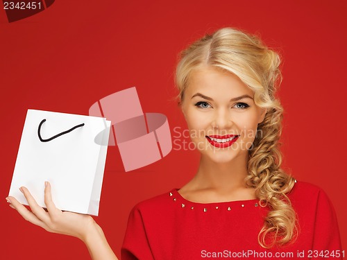 Image of lovely woman in red dress with shopping bag