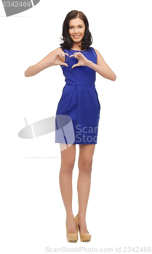 Image of lovely woman showing heart shape