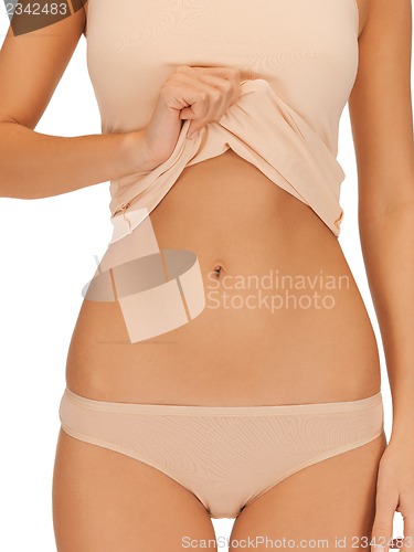 Image of woman body in beige cotton undrewear