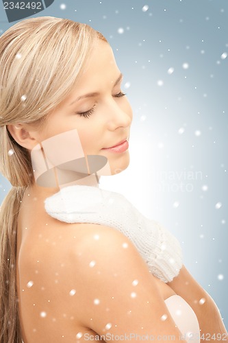 Image of beautiful woman in white mittens