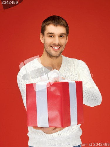 Image of handsome man with a gift