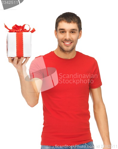 Image of handsome man with a gift