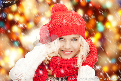 Image of beautiful woman in hat, muffler and mittens