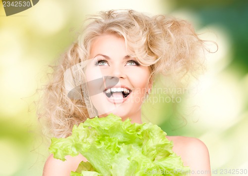 Image of beautiful housewife with lettuce