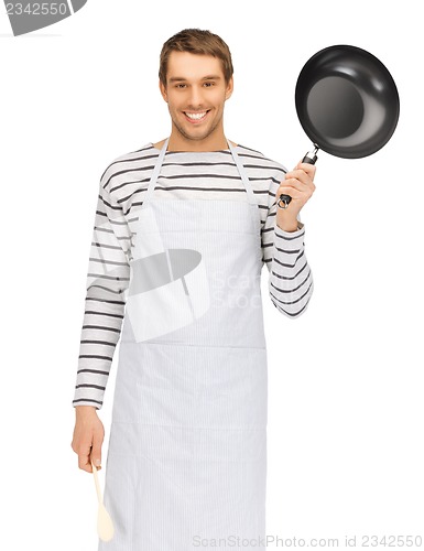 Image of handsome man with pan and spoon